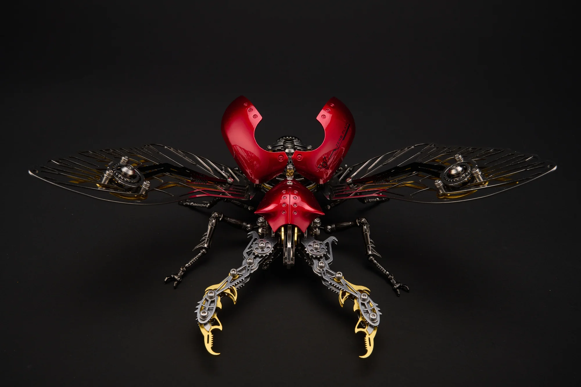 Front view of a red mechanical Stag Beetle with open wings